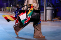 A model presents a bag creation by designer Virgil Abloh during a preview show for his Fall/Winter 2019-2020 collection for fashion house Louis Vuitton during Men's Fashion Week in Paris, France, January 17, 2019. REUTERS/Gonzalo Fuentes