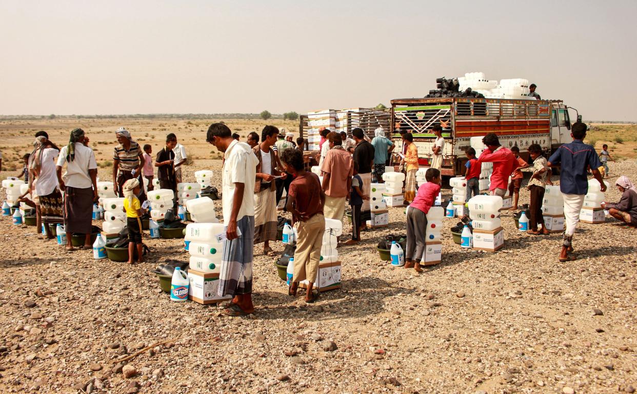 <p>Nearly 200 aid organisations had urged the government to step back from the cut</p> (AFP via Getty Images)