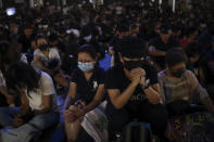 Protesters attend a prayer rally at Edinburgh Place in Hong Kong, Saturday, Oct. 19, 2019. Hong Kong pro-democracy protesters are set for another weekend of civil disobedience as they prepare to hold an unauthorized protest march to press their demands. (AP Photo/Mark Schiefelbein)