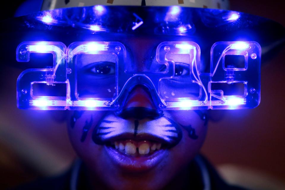 CJ David, 8, sports facepaint, a hat and 2019 glasses at Opening Night 2019 in downtown Oklahoma City.