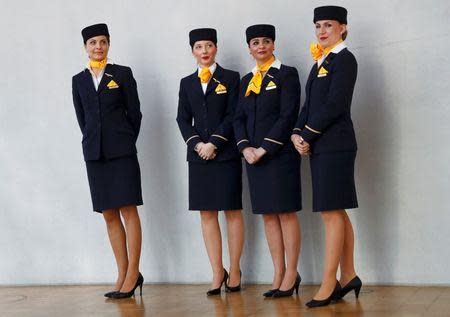 Lufthansa personnel wait to welcome CEO Carsten Spohr and CFO Simone Menne before a news conference at Lufthansa headquarters in Frankfurt, Germany, March 17, 2016. REUTERS/Kai Pfaffenbach