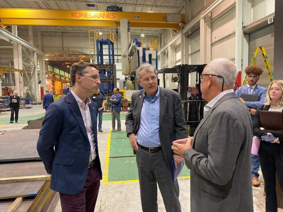 Sen. Sherrod Brown, D-Ohio, visited his hometown Friday and toured the Ideal Electric Company at 330 E. First St. Here Brown, center, talks with Nic Phillips, vice president, at left, and Jim Petersen, the company's owner.