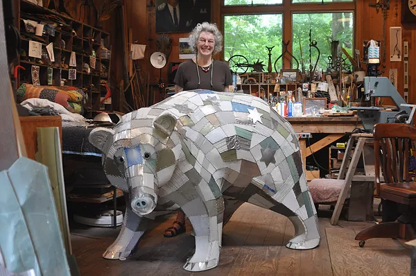 Artist Robin Tost in her Western Massachusetts studio with her "Spirit Bear" creation, part of the exhibit at Cahoon Museum of American Art.