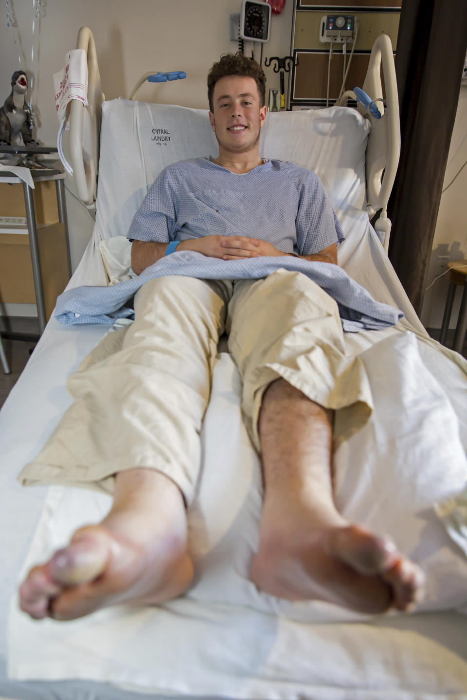 In this Tuesday, Jan. 7, 2020, photo provided by University of Utah Health, Nicolas Stacy-Alcantara, 17, of Fresno, Calif., poses for a photo at University of Utah Hospital in Salt Lake City, where he is recovering after surviving a night alone on the Utah mountains. (Jen Pilgreen/University of Utah Health via AP)