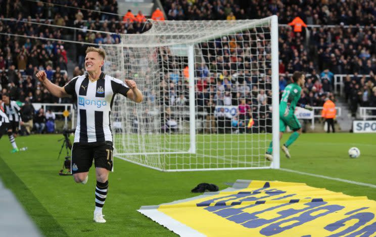 Matt Ritchie celebrates after he scores the third for his team from the penalty spot