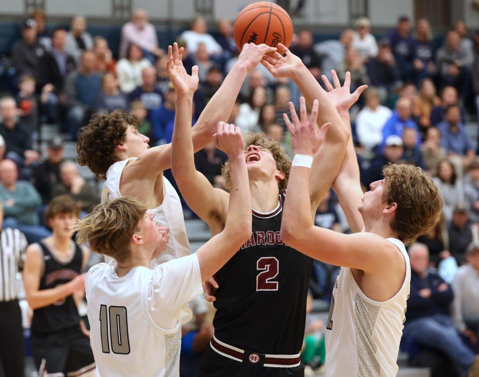 Holland Christian's Luke Michmerhuizen goes up for a shot at Hudsonville Unity Christian on Tuesday, Jan. 23, 2024.