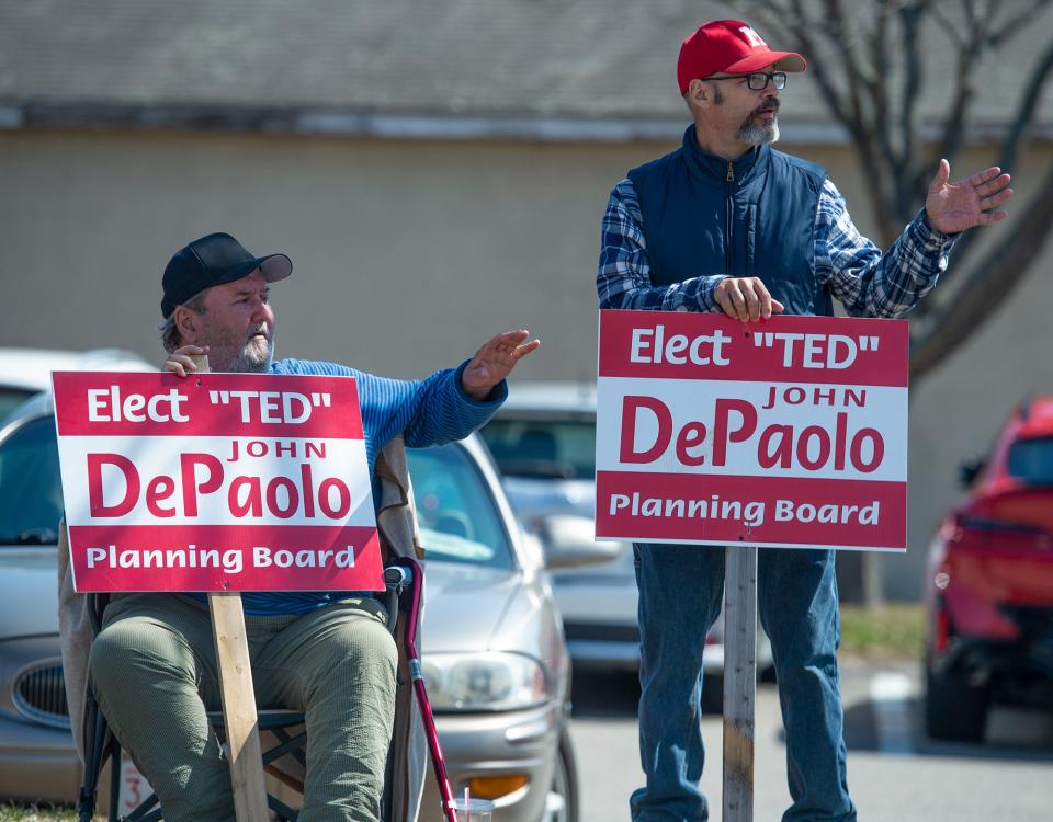 John "Ted" DePaolo Jr., right, is shown campaigning for a seat on the Planning Board in April, which he won. DePaolo, a former firefighter, died earlier this month of occupational cancer.