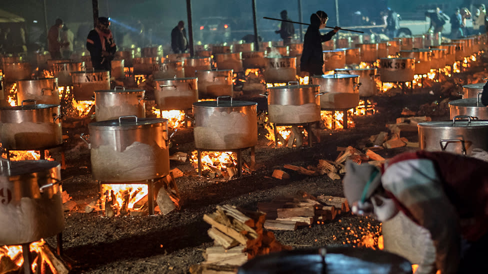 Pots on flames for a meal being prepared by Nakhlistan Eid Cooking at Callies Rugby Field in Cape Town, South Africa - Wednesday 10 April 2024