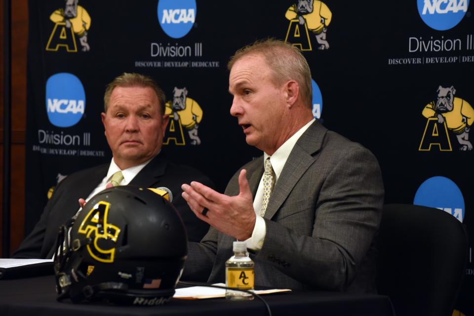 Adrian College new head coach Joe Palka answers questions while AD Craig Rainey listens during Monday's press conference.