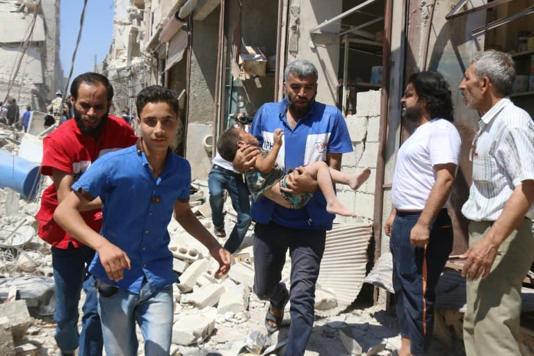 Omran is one of thousands of children wounded in conflict-wracked Syria. Here, a civil defence volunteer carries an injured boy following a reported air strike in Aleppo