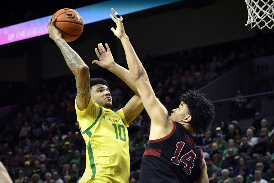 Oregon center Kel'el Ware (10) shoots over Stanford forward Spencer Jones (14) during the first half of an NCAA college basketball game Saturday, March 4, 2023, in Eugene, Ore. (AP Photo/Andy Nelson)