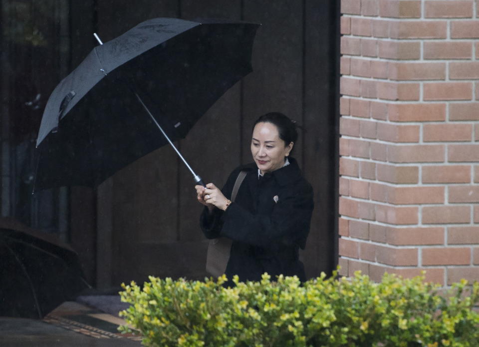 Meng Wanzhou, chief financial officer of Huawei, leaves her home to go to B.C. Supreme Court in Vancouver, Thursday, January, 23, 2020. Wanzhou is in court for hearings over an American request to extradite the executive of the Chinese telecom giant Huawei on fraud charges. (Jonathan Hayward/The Canadian Press via AP)