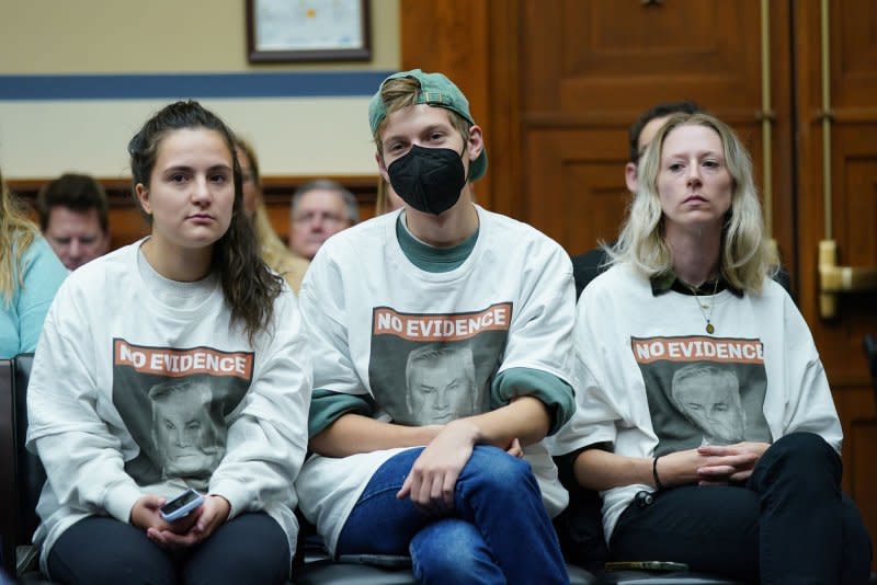 Spectators wear t-shirts with the statement "No Evidence." Photo by Bonnie Cash/UPI