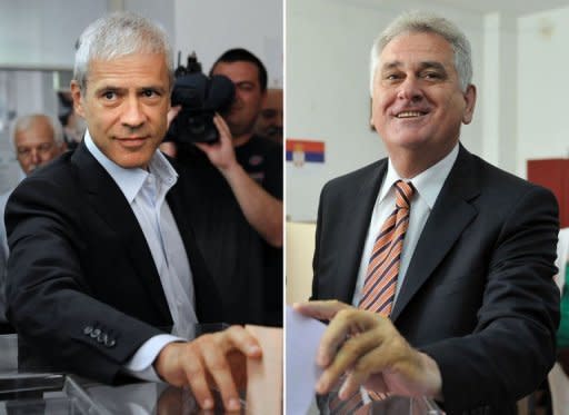 Presidential candidates Tomislav Nikolic (R), leader of Serbian Progressive Party (SNS), and Serbian incumbent President Boris Tadic (L) and leader of the Democratic Party (DS) cast their ballots at polling stations in Belgrade. Tadic and Nikolic will contest the second round of presidential elections, estimates showed Sunday