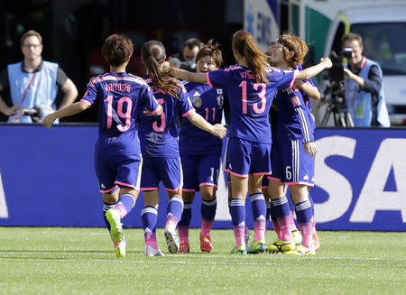 Jul 1, 2015; Edmonton, Alberta, CAN; Japan celebrates after a goal by midfielder Aya Miyama (8) during the first half against the England in the semifinals of the FIFA 2015 Women's World Cup at Commonwealth Stadium. Mandatory Credit: Erich Schlegel-USA TODAY Sports -