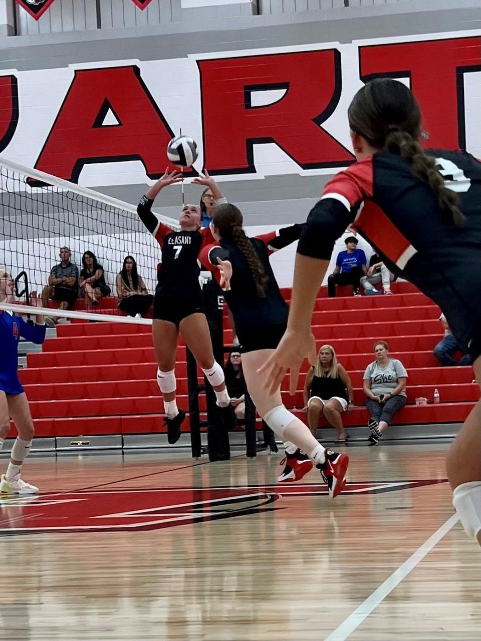 Pleasant's Emerson Williams sets the ball during a match at home against Highland this season.