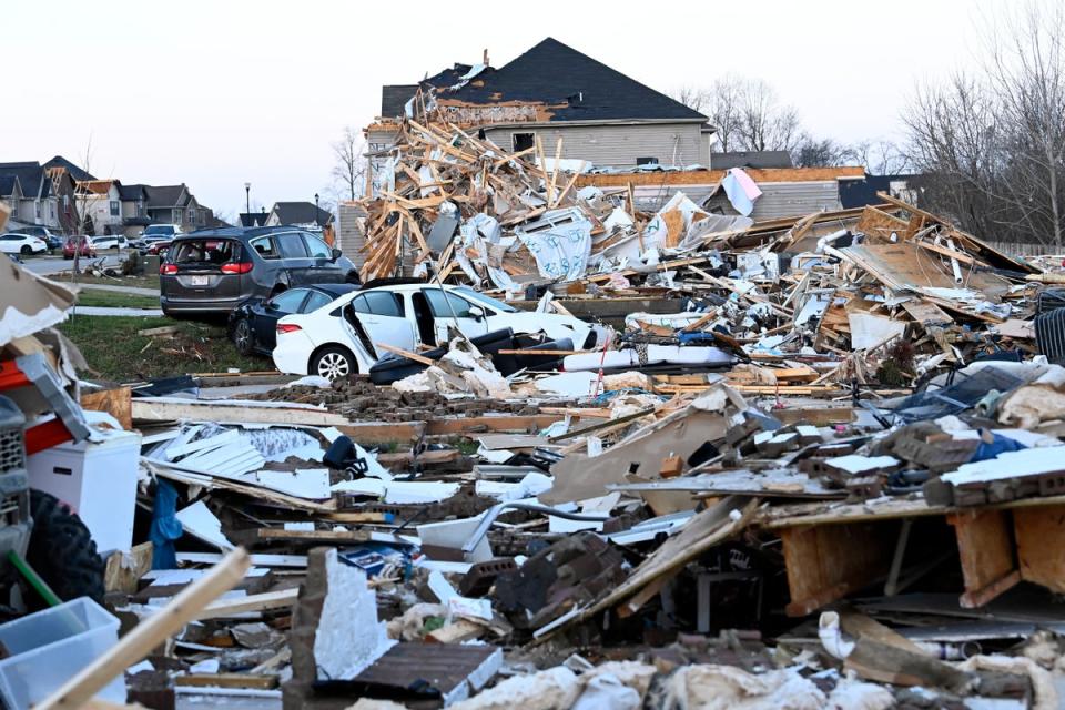 Debris covers the area around homes destroyed in the West Creek Farms neighbourhood of Clarksville, Tennessee on Sunday (AP)