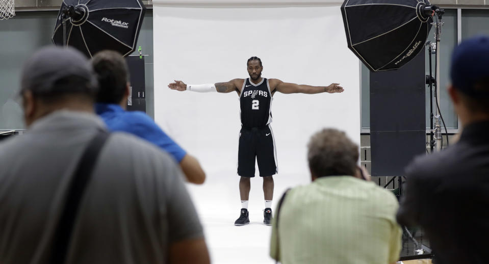 San Antonio Spurs star Kawhi Leonard poses for the cameras on media day. (AP)