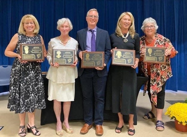 Pictured from Left: Dawn Shonk, accepting on behalf of Carol Israel; Patricia (Lahrmer) Ross, Steve Ehrler, Kathy (Wright) Priest, and Rush Coen Rogers, accepting for the late Stephen Jones.