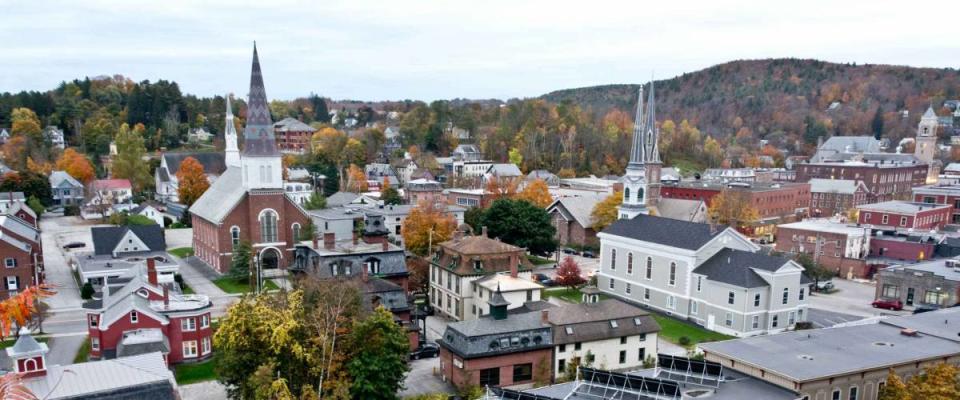 Solar panels grace the roof of an apartment building in this autumn cityscape view of Montpelier, Vermont's state capital.