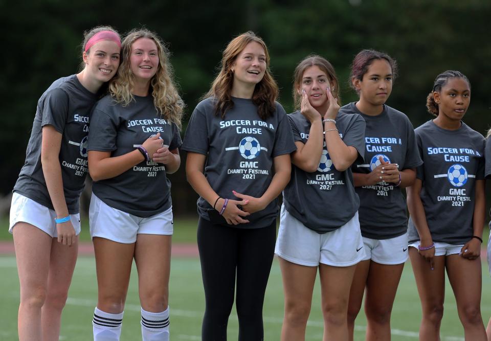 St. Thomas Aquinas players react during the 2021 festival's ceremony.