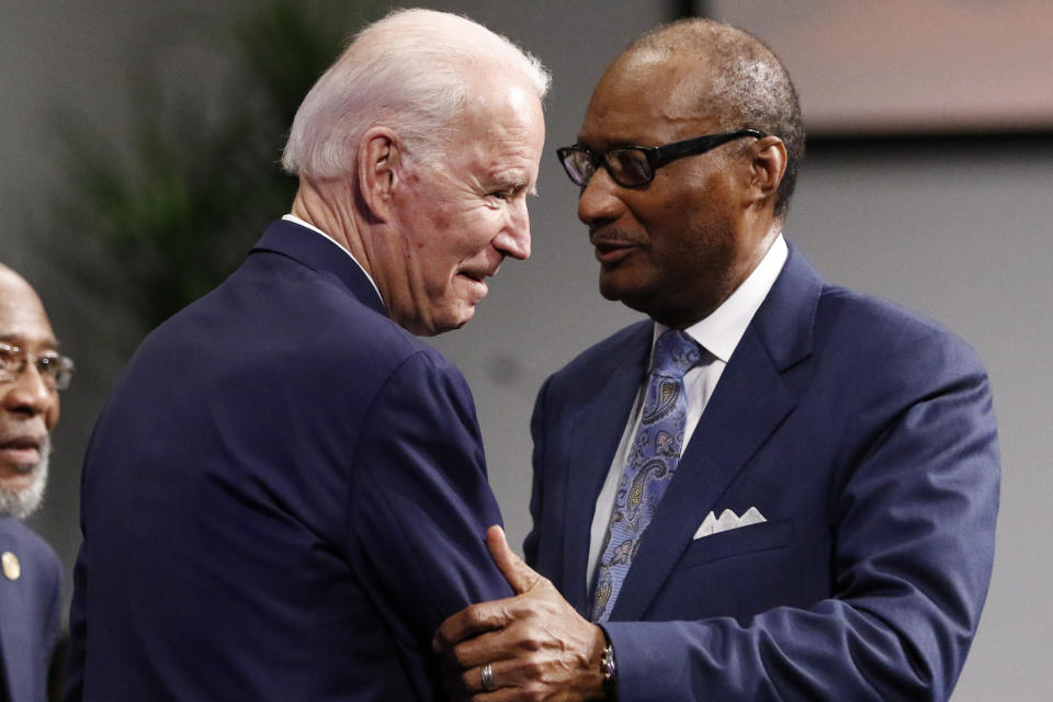 Democratic presidential candidate and former Vice President Joe Biden left, is welcomed by Pastor Jerry Young, prior to speaking at New Hope Baptist Church, Sunday, March 8, 2020, in Jackson, Miss. (AP Photo/Rogelio V. Solis)