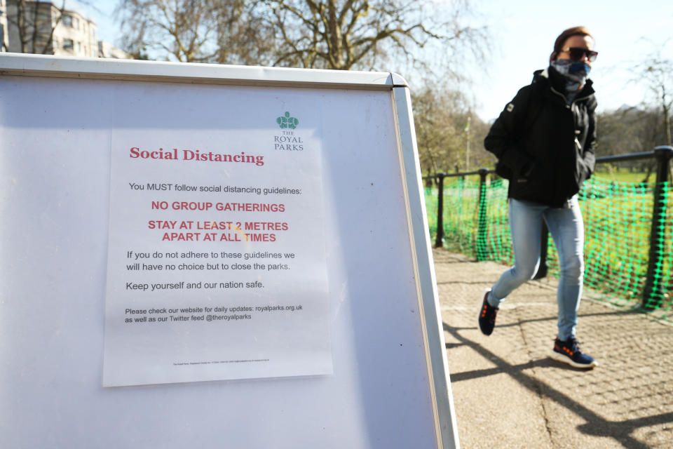 A sign from the Royak Parks notifying the public about social distancing at the Piccadilly entrance to Green Park, London, as Prime Minister Boris Johnson has said the Government is ready to impose tougher restrictions to curb the spread of the coronavirus if people do not follow the guidance on social distancing.