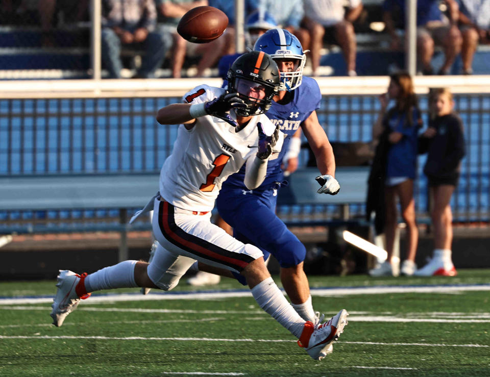 Ryle wide receiver Landon Lorms (1) catches a pass during their football game against Covington Catholic Friday, Aug. 18, 2023.