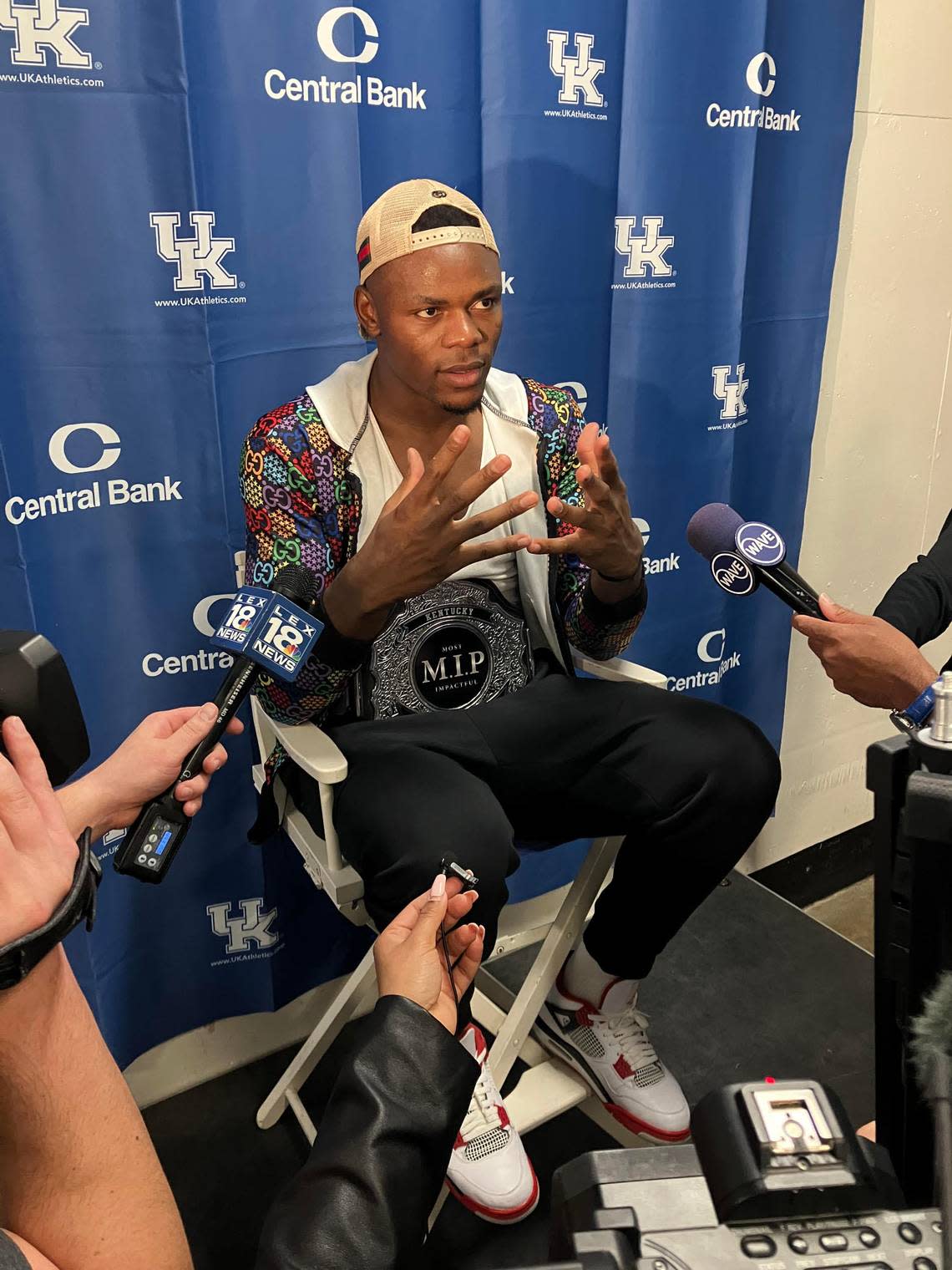 Kentucky’s Oscar Tshiebwe answers questions from media members while wearing UK’s Most Impactful Player belt following the team’s win over North Florida on Nov. 23. The belt is only awarded to a UK player after games that Kentucky wins.