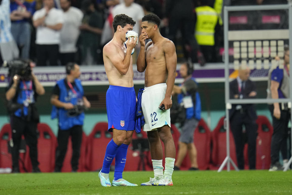 Gio Reyna of the United States, left, talks with England's Jude Bellingham at the end of the World Cup group B soccer match between England and The United States, at the Al Bayt Stadium in Al Khor , Qatar, Friday, Nov. 25, 2022. (AP Photo/Julio Cortez)