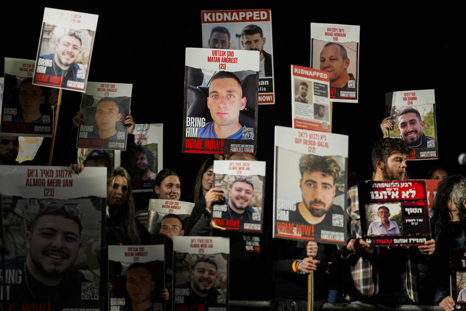 Friends and relatives of the Israeli hostages held in the Gaza Strip by the Hamas militant group attend a rally calling for their release, Saturday, Dec. 9, 2023, in Tel Aviv, Israel. (AP Photo/Ohad Zwigenberg)