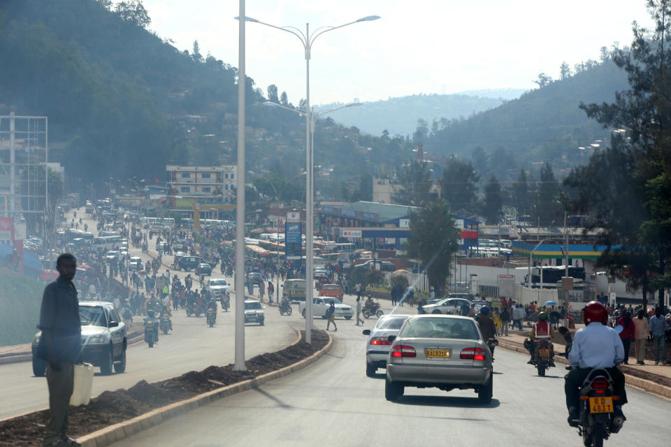 Driving through thick smog in Kigali, Rwanda, on November 14, 2017. The land-locked African nation relies on hydropower and wood-burning for its energy, emissions from which combine with automotive and bike exhaust to form a blanket of pollution. While Rwanda is making an effort to source more climate-friendly fuels, like biogas, the country has already experienced temperature increases higher than the global average, which are projected to continue to rise by 2.5 degrees Celsius from its 1970 temperatures, by the 2050s. (Photograph by Yana Paskova)