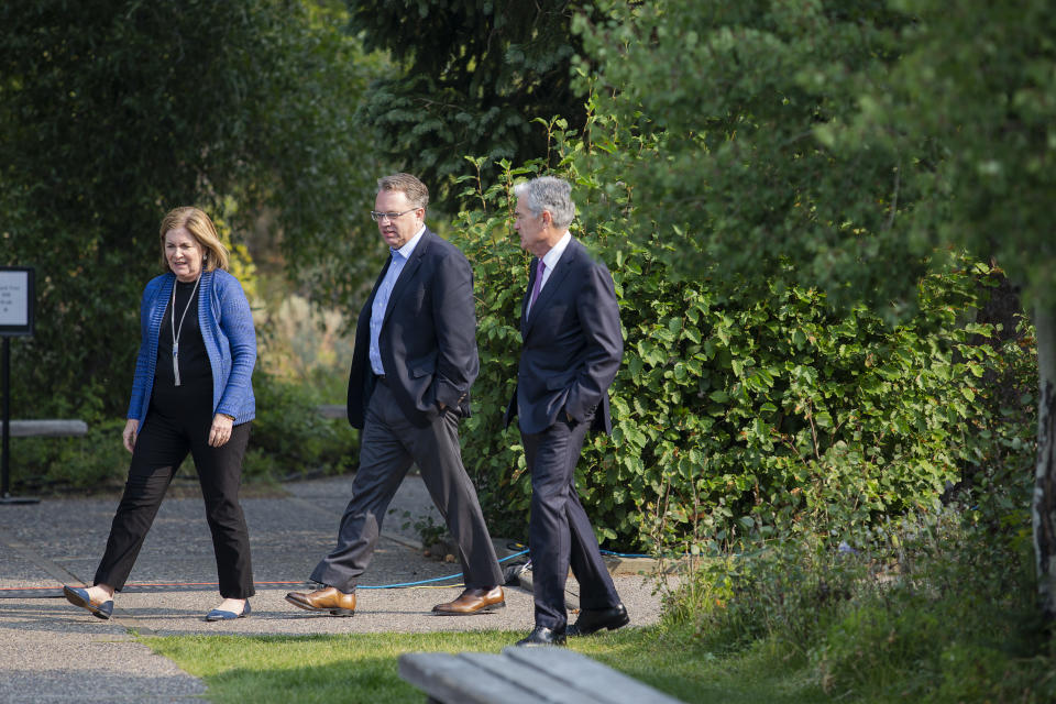 Esther George, left, President and CEO of the Federal Reserve Bank of Kansas City, John Williams, center, President and CEO of the Federal Reserve Bank of New York, and Jerome Powell, Chairman of the Board of Governors of the Federal Reserve System walk together after Powell's speech at the Jackson Hole Economic Policy Symposium on Friday, Aug. 24, 2018 in Jackson Hole, Wyo. Federal Reserve Chairman Jerome Powell signaled Friday that he expects the Fed to continue gradually raising interest rates if the U.S. economic expansion remains strong.  (AP Photo/Jonathan Crosby)