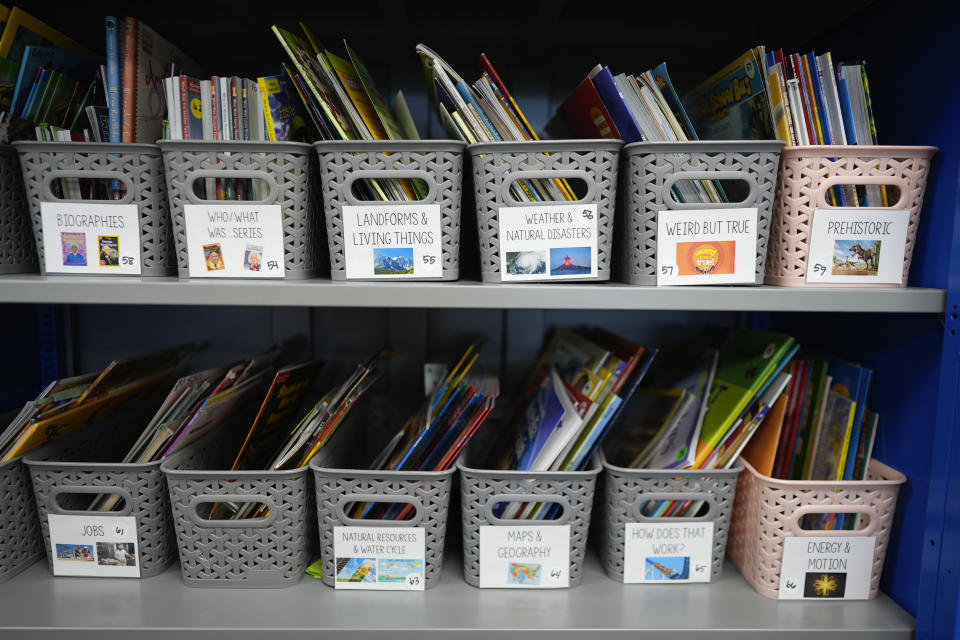 Books are organized by theme inside the classroom of third grade teacher Megan Foster at A.D. Henderson School in Boca Raton, Fla., Tuesday, April 16, 2024. When teachers at the K-8 public school, one of the top-performing schools in Florida, are asked how they succeed, one answer is universal: They have autonomy. (AP Photo/Rebecca Blackwell)