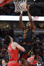 Cleveland Cavaliers guard Collin Sexton, right, drives to the basket against Chicago Bulls guard Tomas Satoransky during the second half of an NBA basketball game in Chicago, Saturday, Jan. 18, 2020. (AP Photo/Nam Y. Huh)