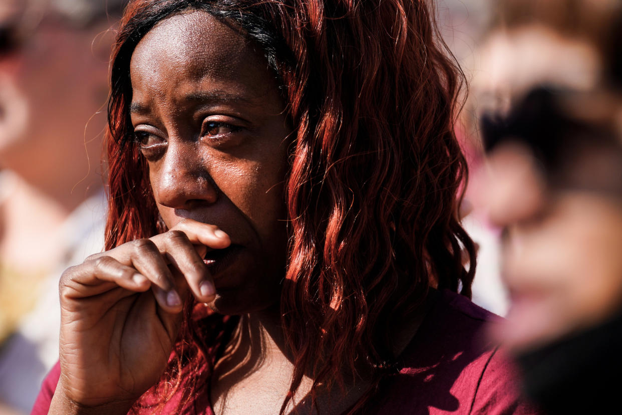 People gather outside the scene of a shooting at a supermarket in Buffalo, N.Y., on May 15, 2022. (Matt Rourke / AP)