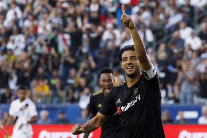 LAFC's CARLOS VELA raises a hand in celebration.