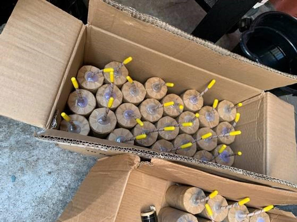 FILE - This July 2021 file photo released by the ATF/United States Attorney's Office Central District of California, shows boxes with large illegal homemade fireworks explosives seized from a home in South Los Angeles. Arturo Ceja III, the man who stockpiled the illegal fireworks in his South Los Angeles backyard — which were later improperly detonated by police, likely causing a massive blast in late June that rocked a neighborhood and injured 17 people — now faces a decade in federal prison. Ceja pleaded guilty Monday, Aug. 30 to one count of transportation of explosives without a license. (ATF/United States Attorney's Office Central District of California via AP, File)