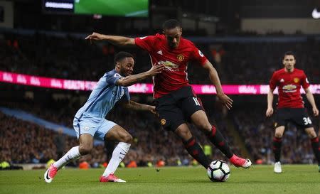 Britain Soccer Football - Manchester City v Manchester United - Premier League - Etihad Stadium - 27/4/17 Manchester United's Anthony Martial in action with Manchester City's Raheem Sterling Action Images via Reuters / Jason Cairnduff Livepic