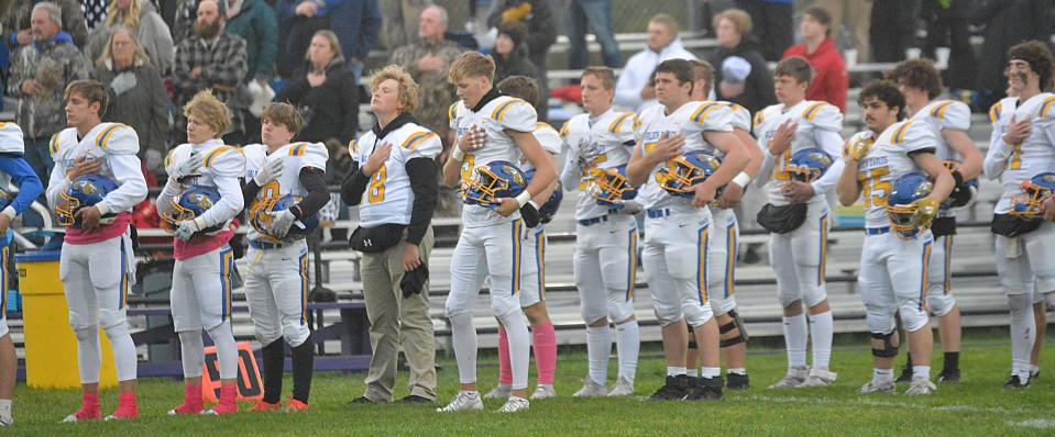Aberdeen Central players are shown during the national anthem prior to their first-round game in the state Class 11AA high school football playoffs on Thursday, Oct. 26, 2023 at Watertown Stadium.