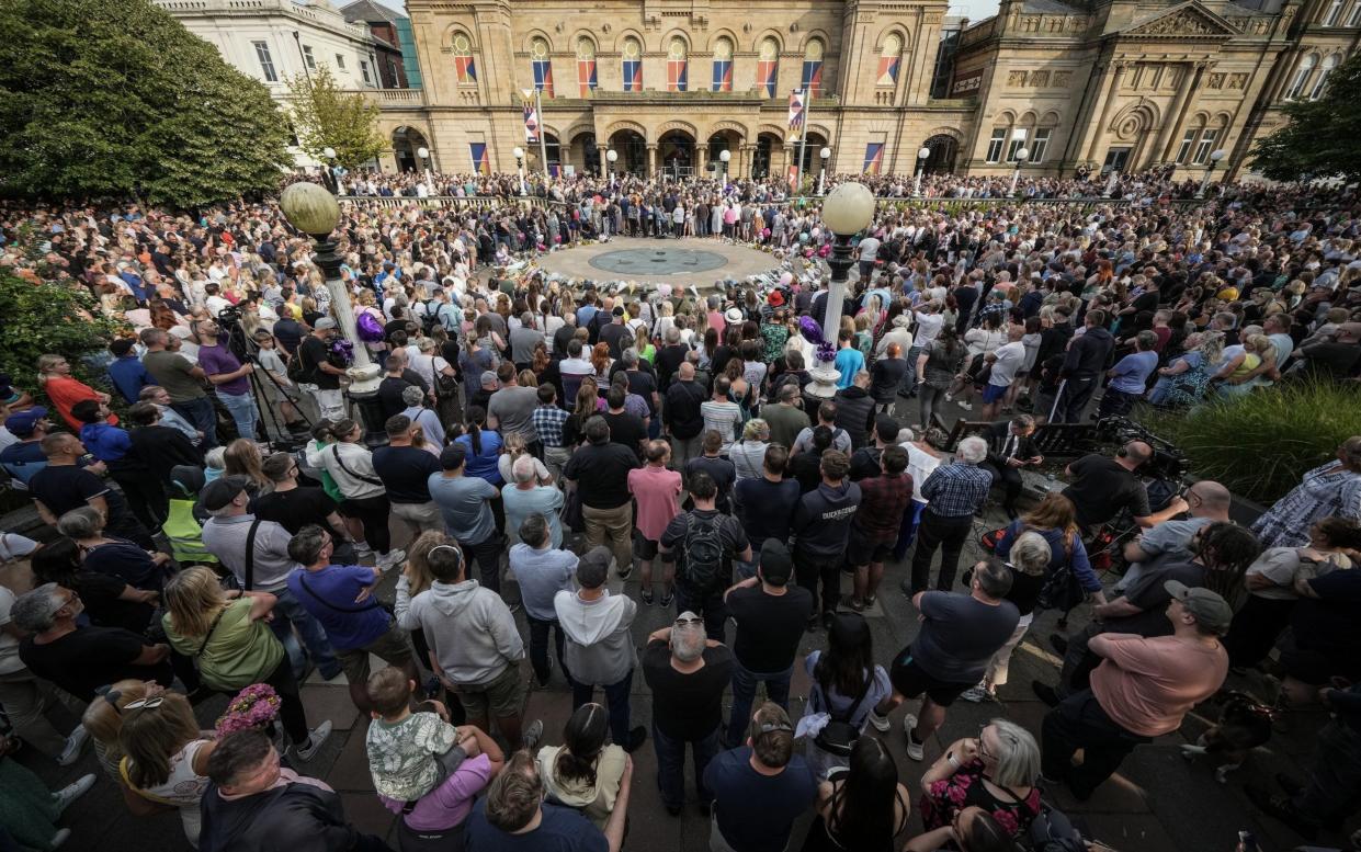 Mourners attended a vigil outside the Atkinson building in central Southport