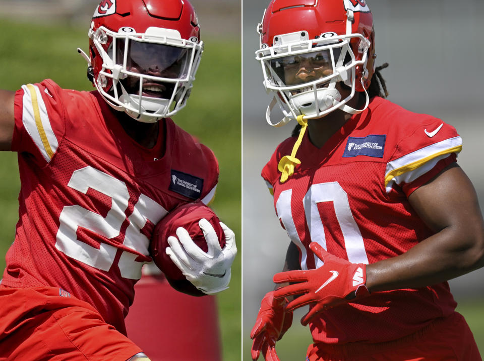 FILE - At left, Kansas City Chiefs running back Clyde Edwards-Helaire runs a drill during the NFL football team's organized team activities Thursday, June 2, 2022, in Kansas City, Mo. At right, Chiefs running back Isiah Pacheco is shown during drills at the NFL football team's mandatory minicamp Tuesday, June 14, 2022, in Kansas City, Mo. A third of the way through training camp, the two are in a heated race to be the starting running back of the Chiefs. (AP Photo/File)