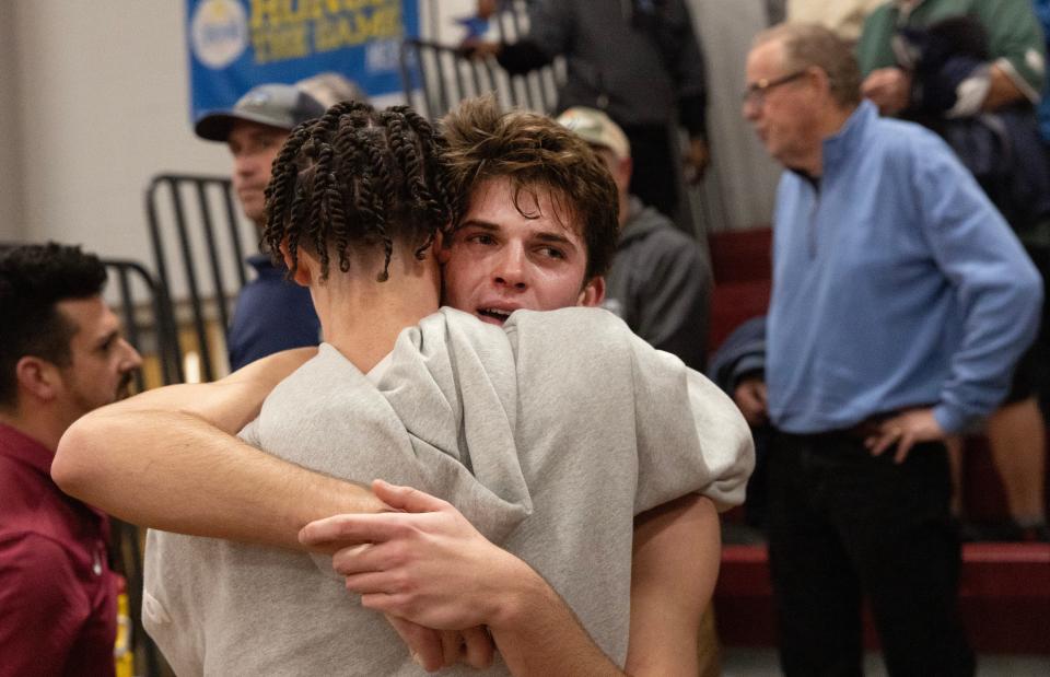 Manasquan’s Griffin Linstra is consoled by a friend after Manasquan’s late basket to win was called off by the referees. Manasquan Boys Basketball lose to Camden in NJSIAA Group 2 Semifinals in Berkeley Township, NJ on March 5, 2024.