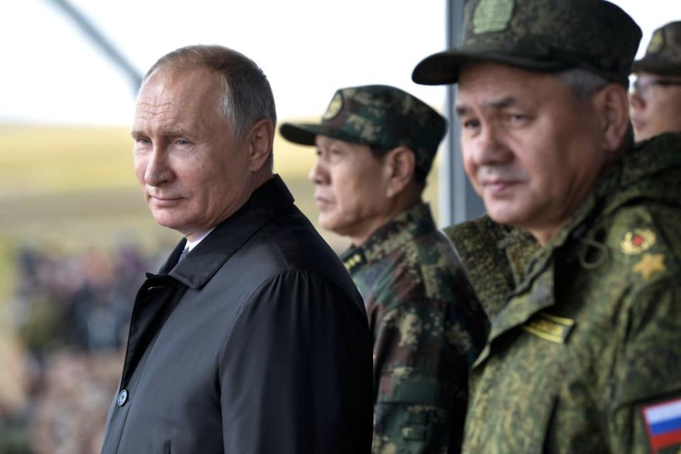 Russia's President Vladimir Putin, China's Defense Minister Wei Fenghe, and Russian Defence Minister Sergei Shoigu watch the parade of the participants of the Vostok-2018 (East-2018) military drills at Tsugol training ground not far from the Chinese and Mongolian border in Siberia, on September 13, 2018.<span class="copyright">Alexey Nikolsky—AFP/Getty Images</span>