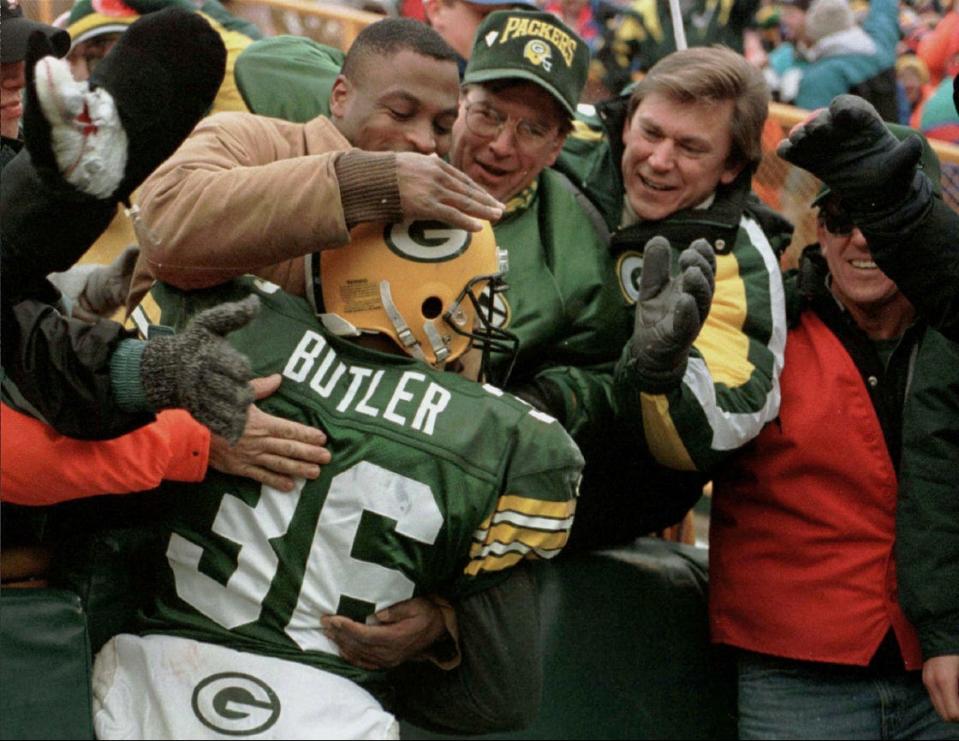 FILE - Green Bay Packers' LeRoy Butler jumps into the crowd following an interception late in the fourth quarter against the Chicago Bears Sunday, Nov. 12, 1995, in Green Bay, Wis. The Packers won 35-28. 