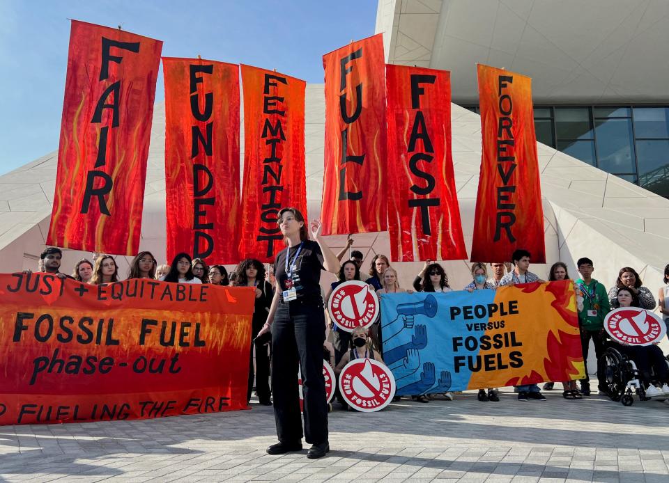 Climate activists protest after a draft of a negotiation deal was released, at the United Nations Climate Change Conference Cop28 in Dubai, United Arab Emirates, 13 December 2023 (Reuters)