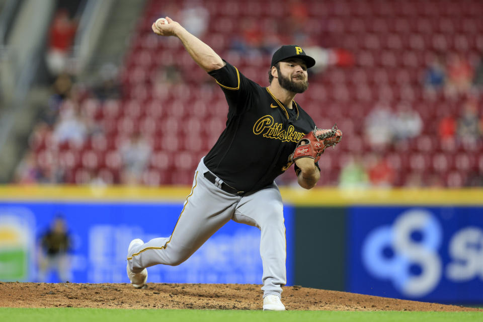 Pittsburgh Pirates' Bryse Wilson throws during the second inning of a baseball game against the Cincinnati Reds in Cincinnati, Monday, Sept. 12, 2022. (AP Photo/Aaron Doster)
