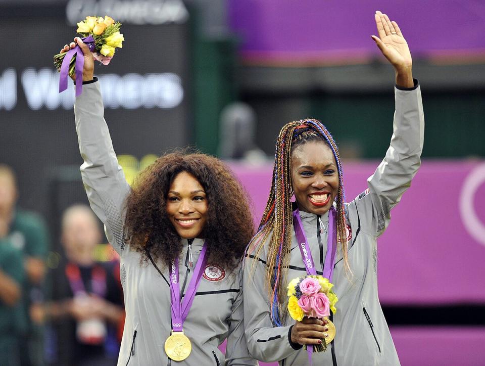 Serena Williams and Venus Williams after winning gold in the Women's Doubles The 2012