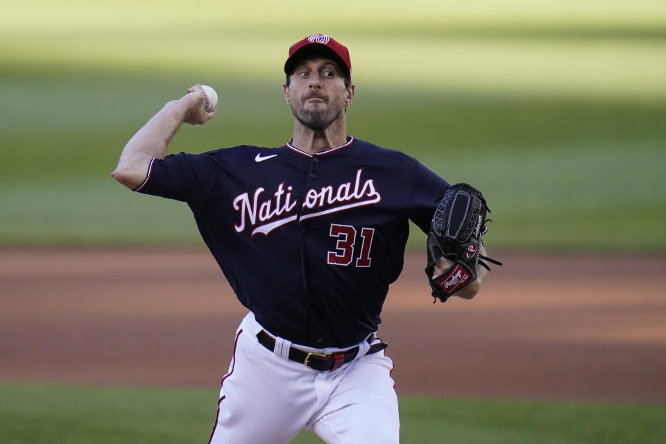 Washington Nationals starting pitcher Max Scherzer throws a pitch to the Los Angeles Dodgers during the first inning of a baseball game, Friday, July 2, 2021, in Washington. (AP Photo/Julio Cortez)