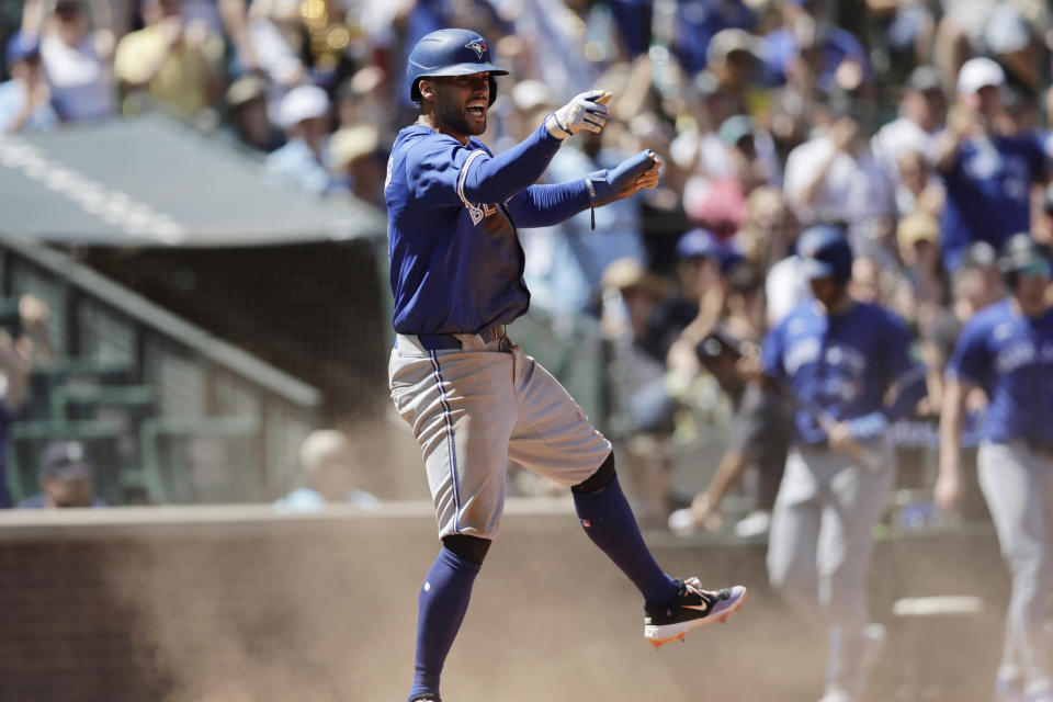 Toronto Blue Jays' George Springer reacts after scoring against the Seattle Mariners during the fifth inning in a baseball game, Saturday, July 6, 2024, in Seattle. (AP Photo/John Froschauer)